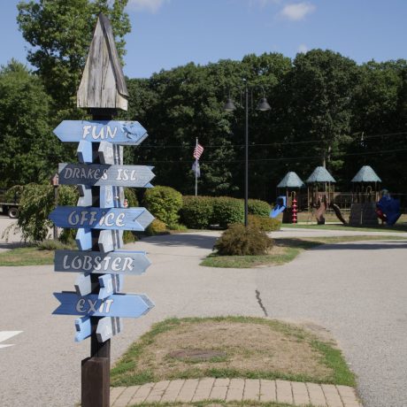 road sign with playground